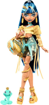 Păpușa Monster High Cleo De Nile într-o bluză aurie și o fustă cu mai multe straturi, include cobra Hissette și accesorii precum un ghiozdan, o gustare și un sul de hârtie igienică, HXH74