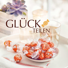 Lindt LINDOR Bolas de chocolate rojo y naranja | Bolsa resellable de 1 kg | aprox. 80 caramelos de chocolate con relleno que se deshace en la boca | Paquete a granel, regalo de chocolate.