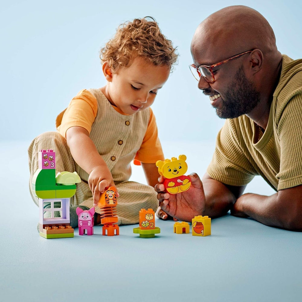 LEGO DUPLO - Fiesta de cumpleaños de Winnie the Pooh de Disney - juguete educativo para preescolares - juego de 3 minifiguras, incluidos Winnie the Pooh, Tigger y Piglet - idea de regalo para niños y niñas a partir de 1,5 años 10457 Juegos de construcción Beuche den LEGO-Store