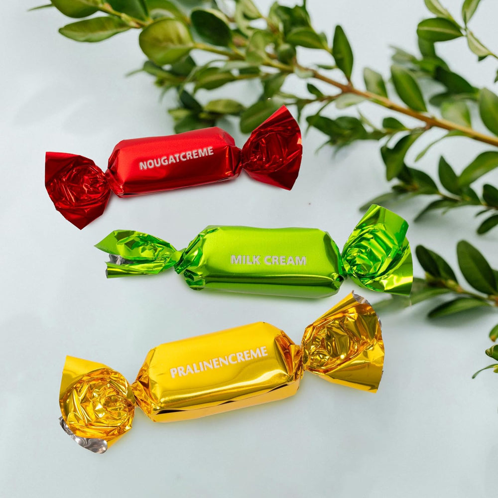 Caja de regalo con tarjeta de Pascua de Heidel, 183 g, praliné de chocolate con leche de primera calidad con caja de metal decorativa, ideal como regalo de Pascua