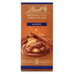 Barra de chocolate con almendras navideñas Lindt | 100 gramos | Almendras en crema de nueces recubiertas del más fino chocolate con leche | regalo de chocolate de navidad