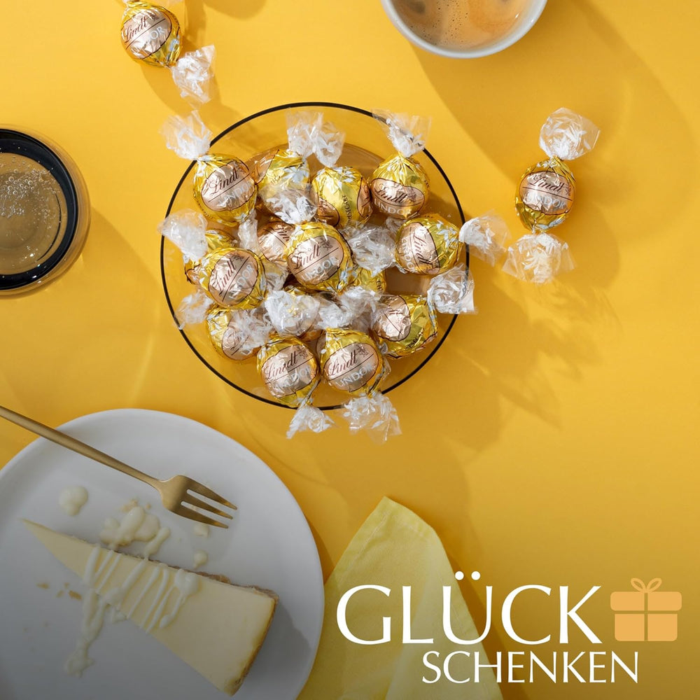 Chocolate Lindt | Bolsa de tarta de queso LINDOR | 1 kilogramo | 80 bolas de chocolate con leche blanco con relleno de tarta de queso que se derrite en la boca | Regalo de chocolate para compartir