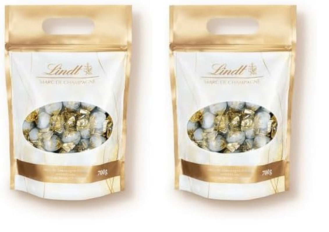 Bolas de chocolate Lindt Marc de Champagne | 700 gramos Aprox. 56 caramelos de chocolate con leche con relleno refinado, contiene alcohol | Paquete a granel | Regalo de chocolate | regalo de chocolate