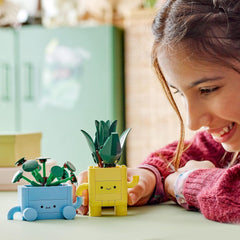 LEGO Botanicals Happy Plants - Set de bricolaje para niños con 2 flores artificiales y 2 macetas de colores con caritas de dibujos animados - Idea de regalo para niñas a partir de 9 años - 10349 Besuche sets de construcción den LEGO-Store